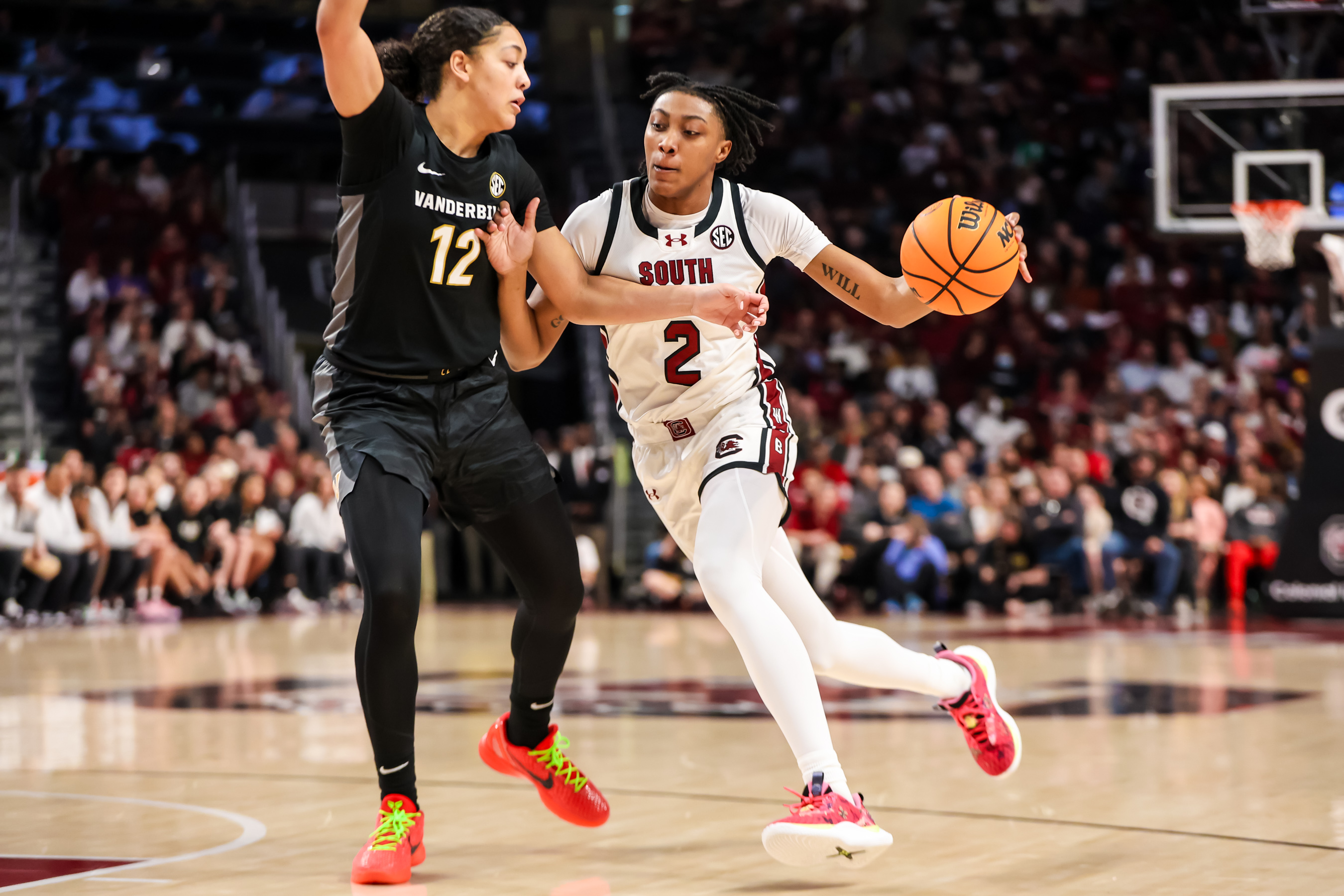 Ashlyn Watkins attempts to drive around Vanderbilt Commodores forward Khamil Pierre (28th Jan., 2024)